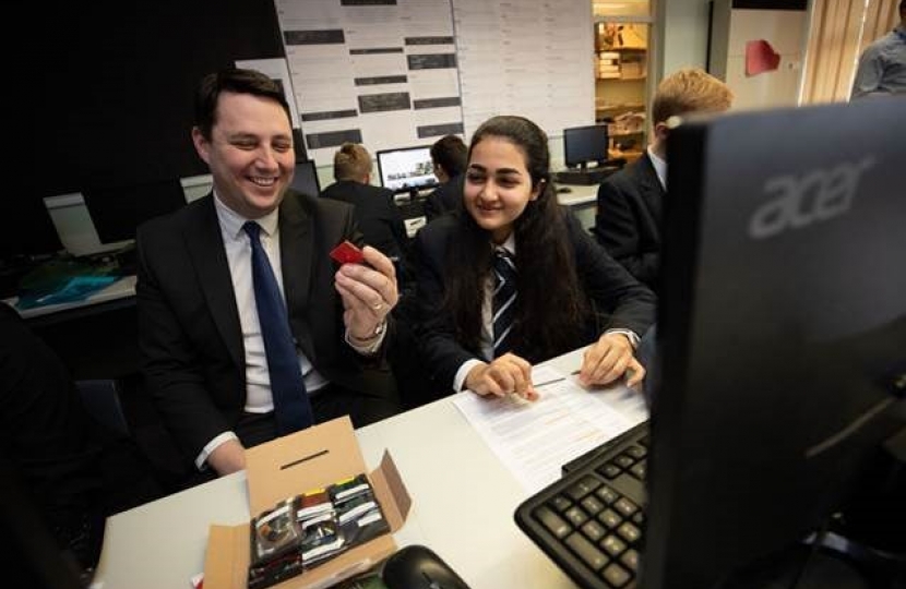 Tees Valley Mayor Ben Houchen with young engineer Roxanne and the satellite components