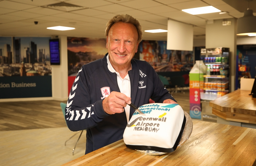 Neil Warnock at Teesside International Airport cutting the cake for the launch of the Cornwall Airport Newquay route