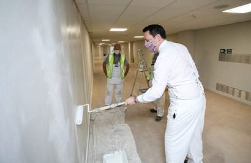 The Mayor pitching in to help with the painting work