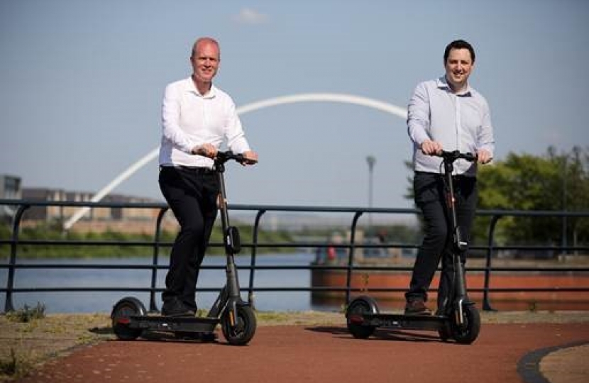 Paul Hodgins, left, with Tees Valley Mayor Ben Houchen on the e-scooters