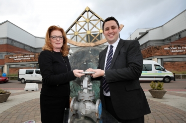 Siobhan McArdle, left, and Ben Houchen at James Cook University Hospital, holding a valve similar to the type that will be used in the district heating scheme