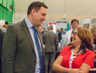 Tees Valley Mayor Ben Houchen speaking to an exhibitor at last year’s Business Summit, and right, exhibitors at last year’s Business Summit