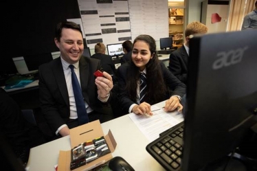 Tees Valley Mayor Ben Houchen with young engineer Roxanne and the satellite components