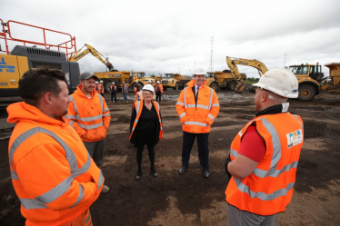 Tees Valley Mayor Ben Houchen and Councillor Mary Lanigan, Leader of Redcar & Cleveland Council and South Tees Development Corporation Board member speak to workers on site