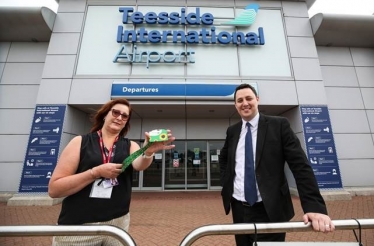 Helen Jaques with Mayor Houchen and a Sunflower scheme lanyard at Teesside International Airport