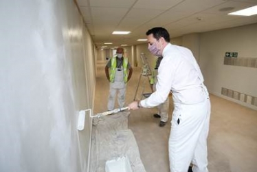 The Mayor pitching in to help with the painting work